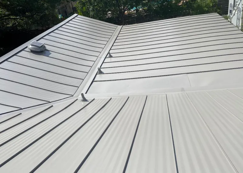 Solar attic fan installed on a metal roof for Roof Ventilation in Golden Hills
